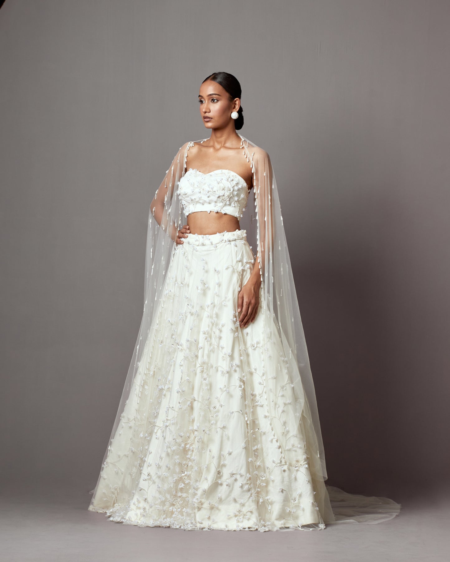 Aishwarya Avlani in Ivory Net Hand Embroidered Lehenga Set