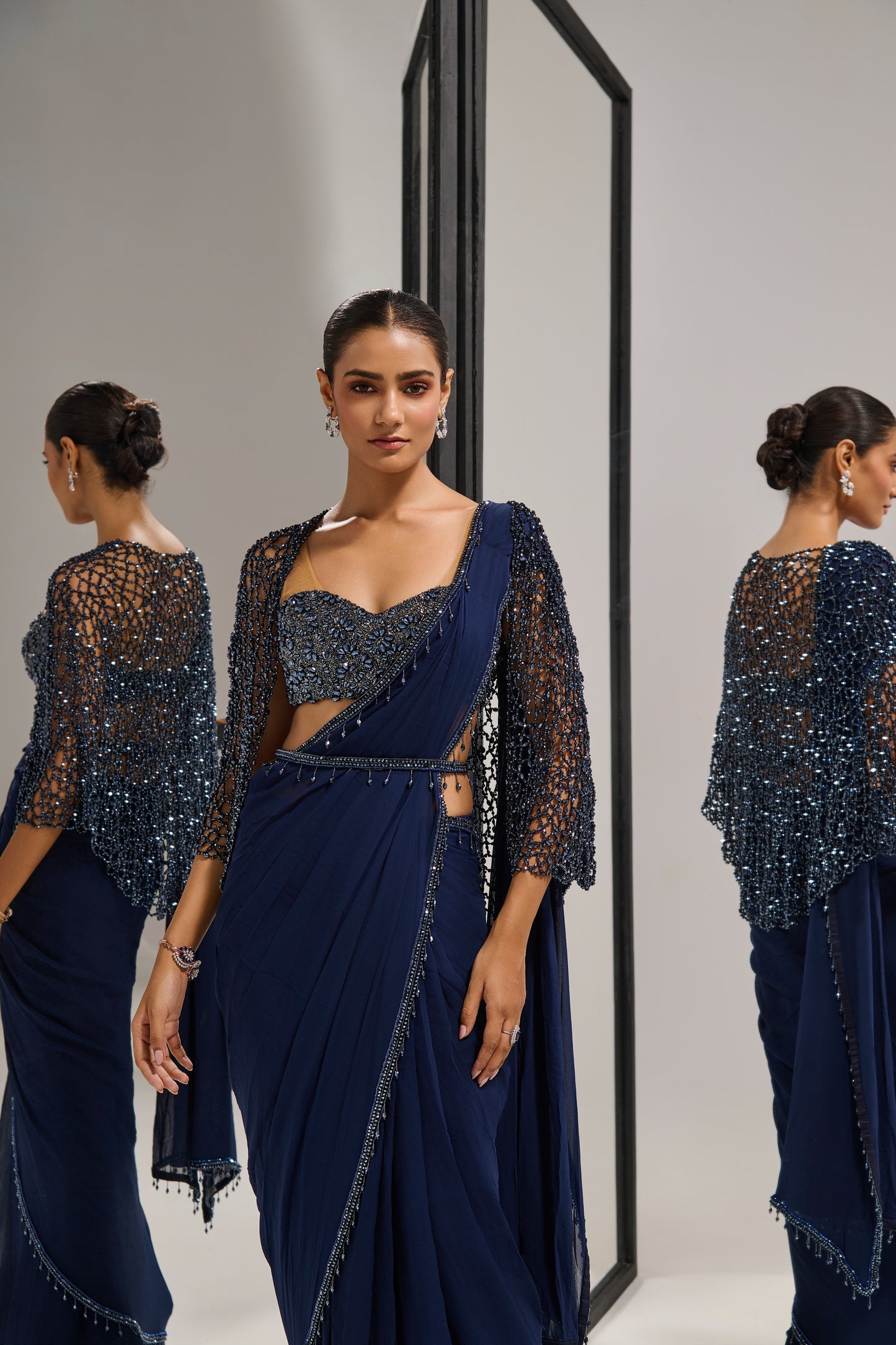 Navy blue saree set with
crystal cape